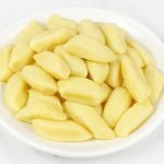 Kopytka Polish Potato Dumplings, served on a plate.