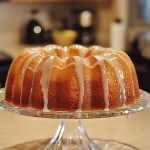 Polish Vanilla Babka, placed on a large glass platter.